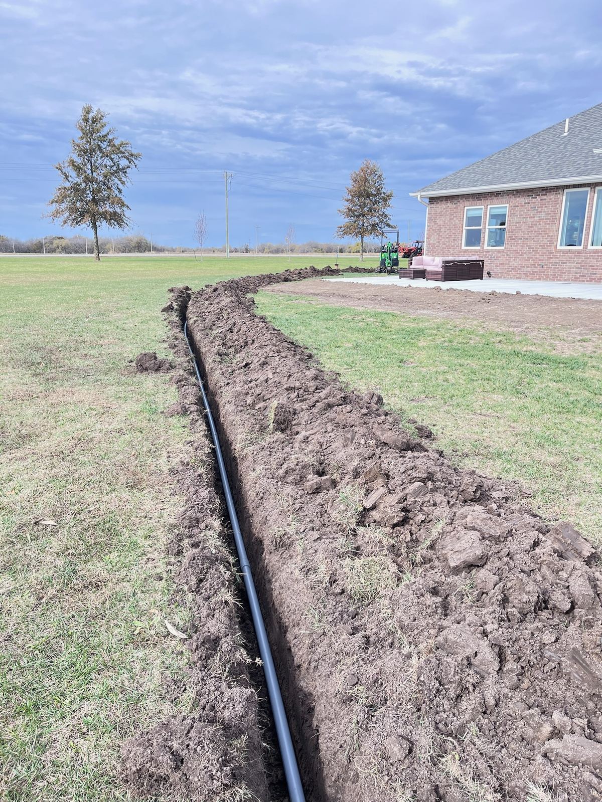 Trench with new conduit run, ready for backfill